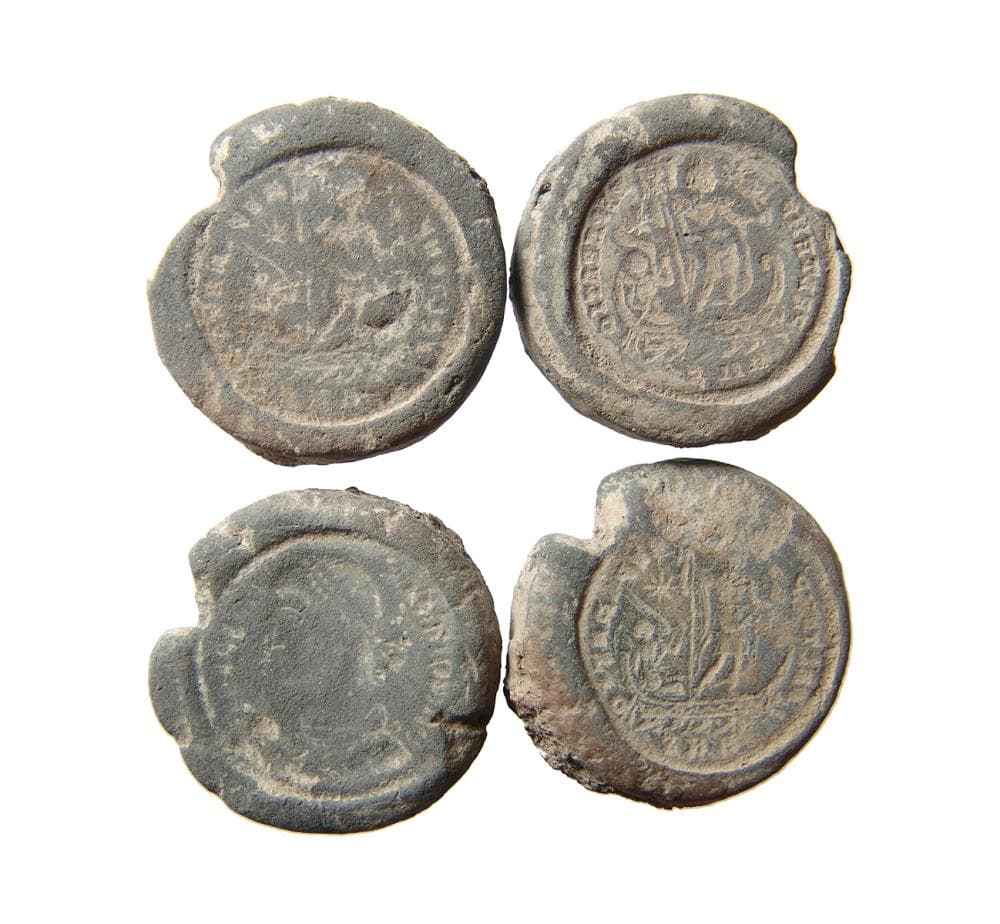 A lot of 4 Roman terracotta counterfeiter/forger's moulds
