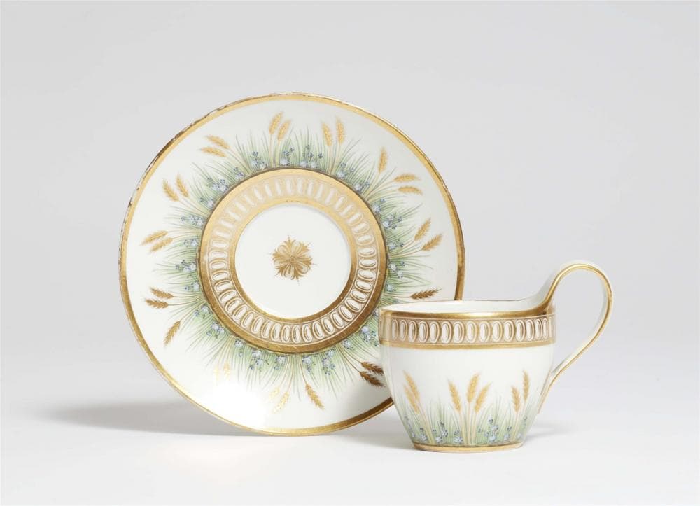 A Berlin KPM porcelain cup with golden wheat motifs