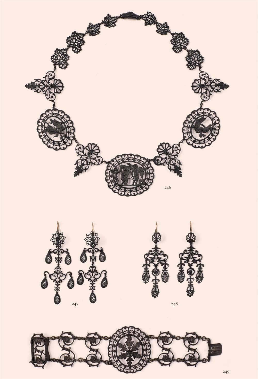 A pair of cast iron pendant earrings