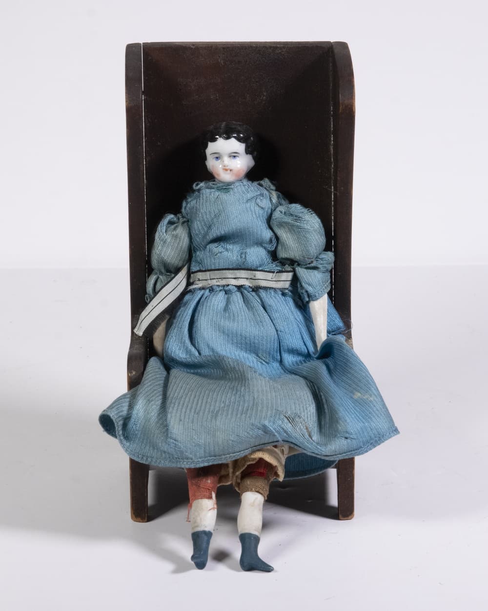 CHINA HEAD DOLL IN WOODEN CHAIR