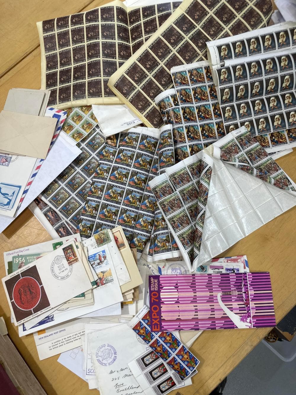 Collection of New Zealand stamp sheets and addressed envelopes