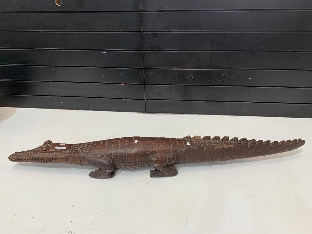 Large hand carved alligator in hardwood. 136cm L, 18cm W, 15cm H.