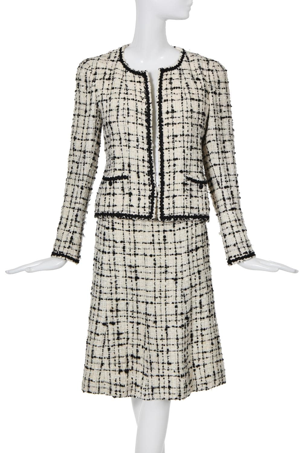 A Chanel black and white bouclé tweed suit, Cruise collection 2003,