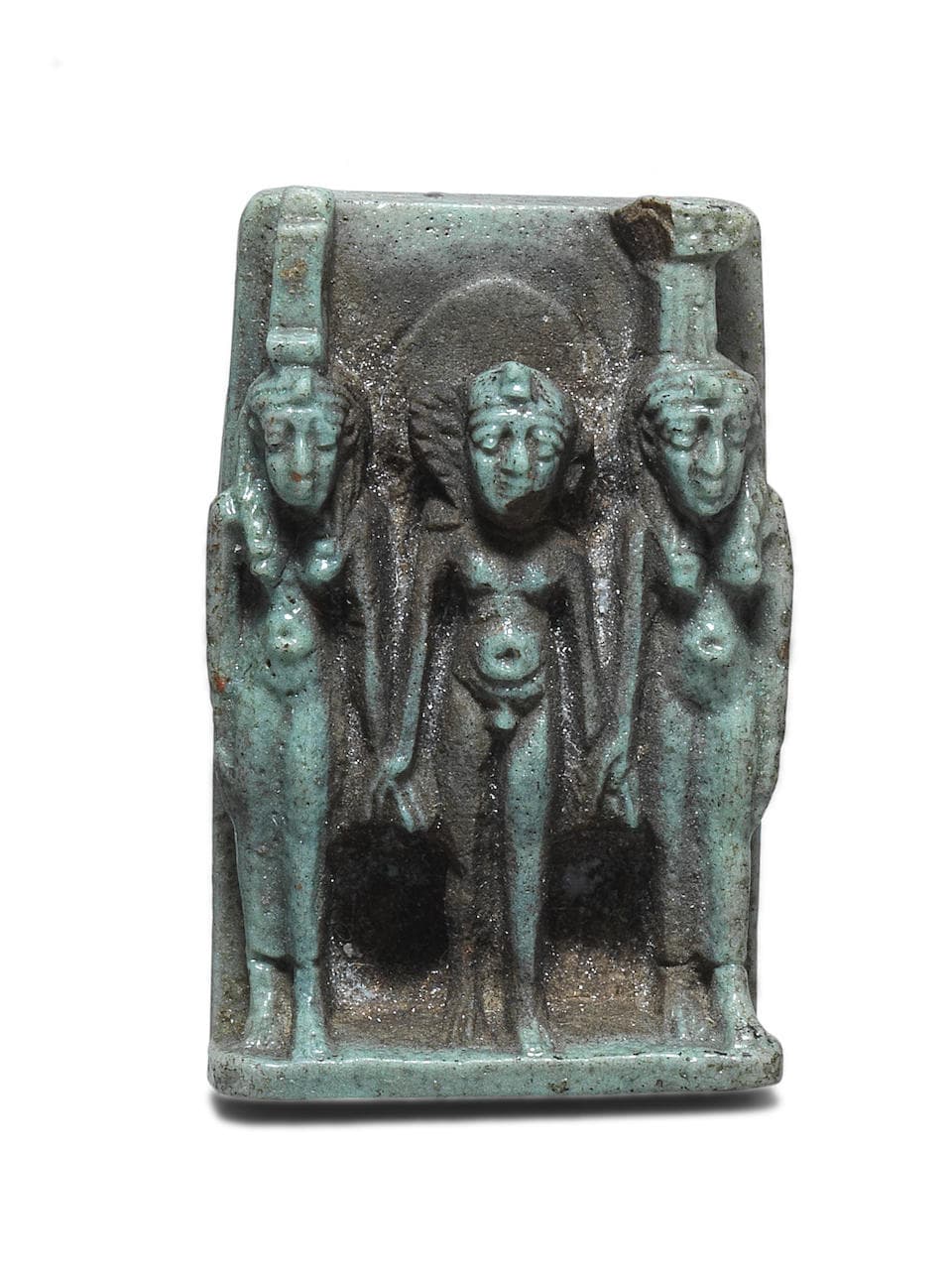 An Egyptian pale green glazed faience triad amuletic plaque