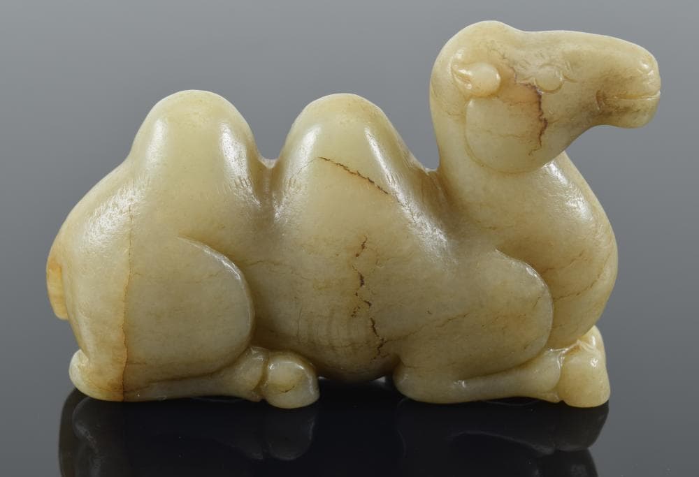 Carved jade camel. China. 19th century. 3.5in length.