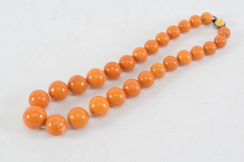 Set of butterscotch amber graduated beads. 18.5in length.