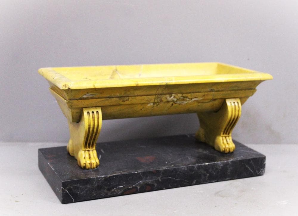 Small marble bath in antique yellow marble