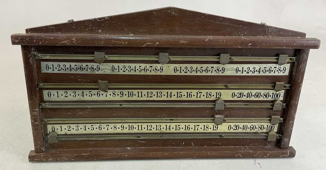 A mahogany billiards scoreboard with brass sliders