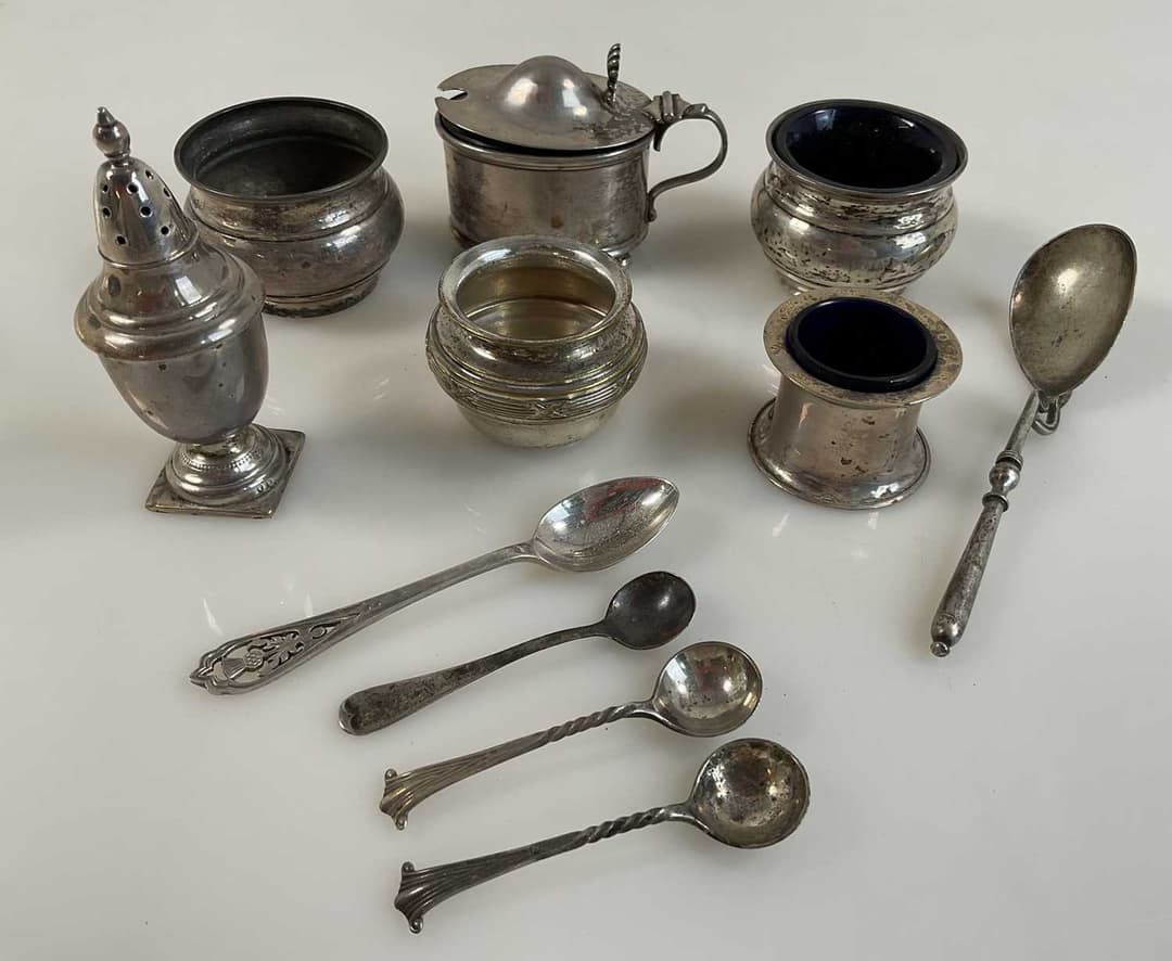 A collection of hallmarked silver to include a pair of salts
