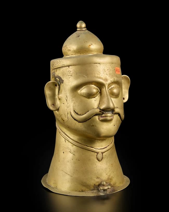 A large brass Siva lingam coverWestern Deccan