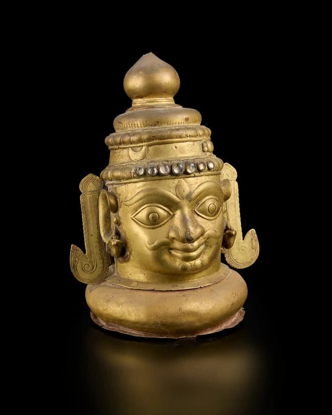 A large brass Siva lingam cover