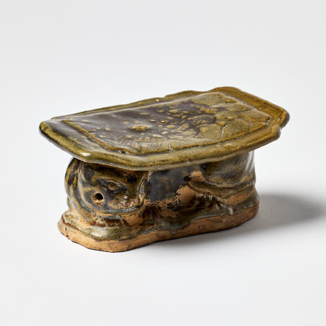 A Chinese Green Glazed Pillow.