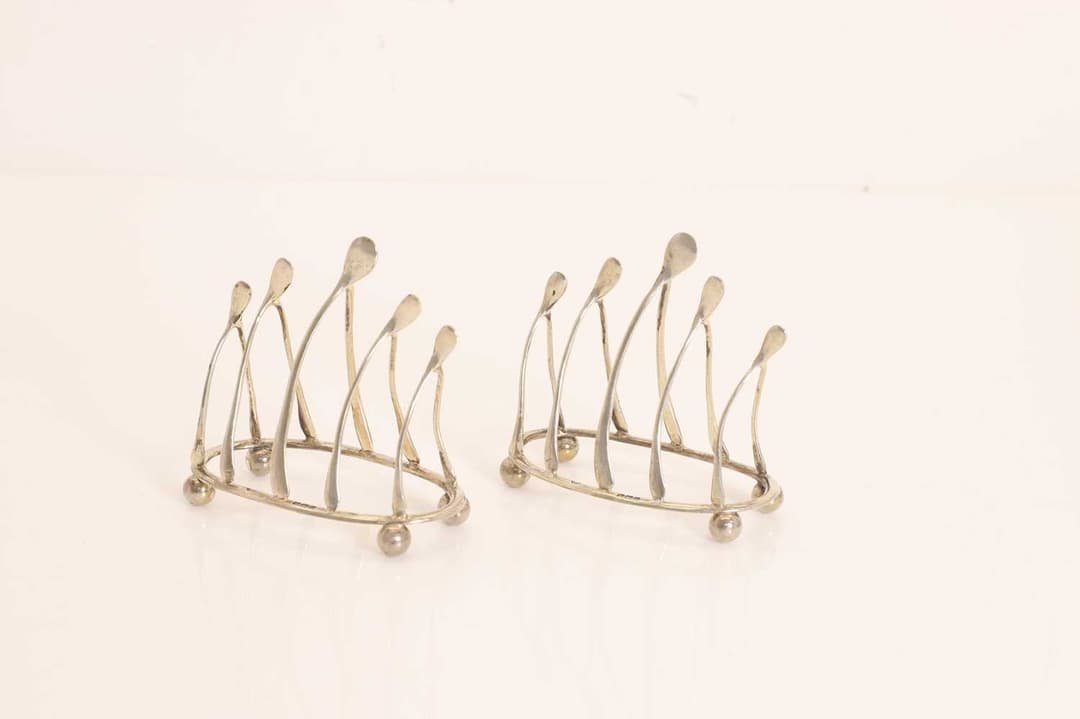 A pair of silver 'Wishbone' toast racks