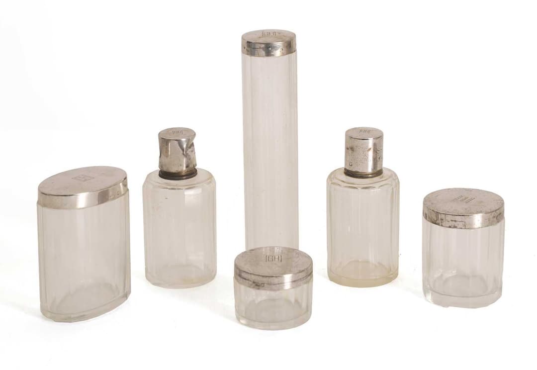 A set of Art Deco silver mounted glass vanity jars