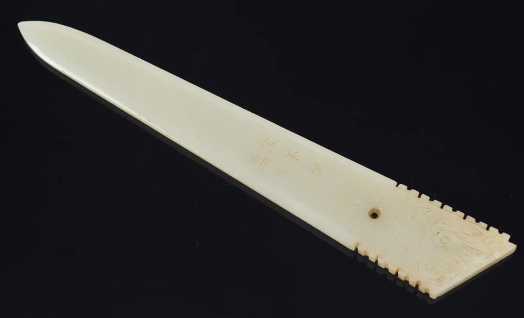 Jade dagger axe ko. China. Archaic style pure white jade and inscription.
