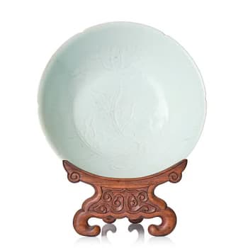 A carved qingbai foliate bowl, Song dynasty (960-1279).