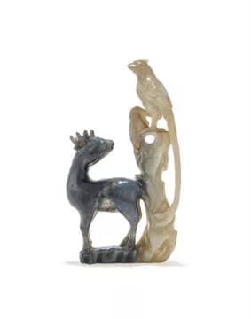 A Chinese black and white jade 'Crane and deer' carving group