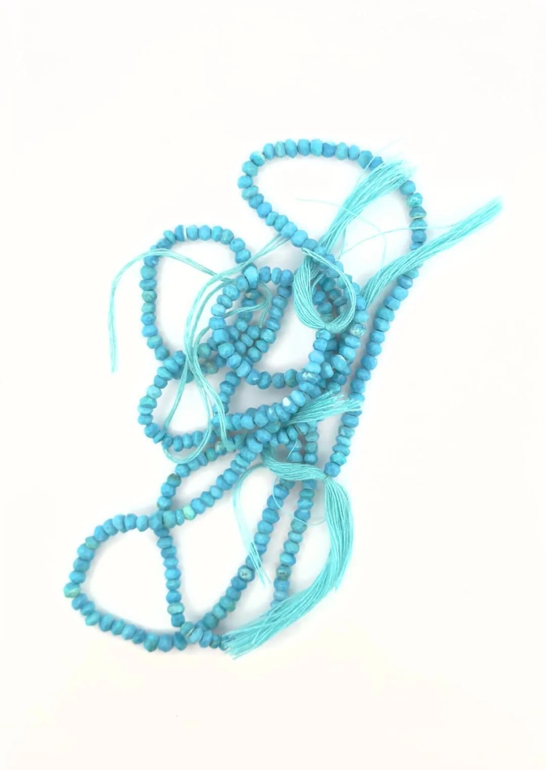 Two strands of irregular faceted turquoise beads. Weight: 50 - Lot 80