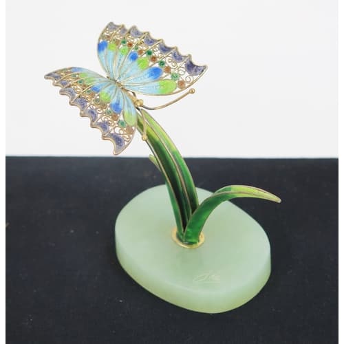 Su Hai, a silver and enamel butterfly on reed, on an oval ja...