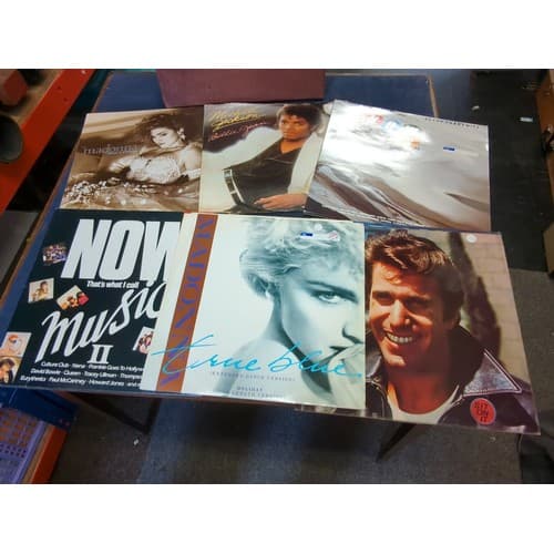 A collection of pop music vinyl records, including Michael J...
