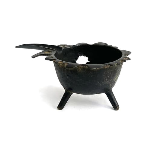 A small bronze oil lamp possibly c.1700 (af), 11cmH