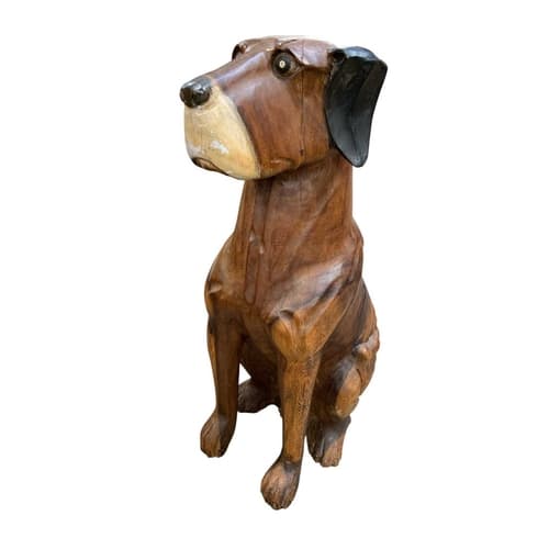 A contemporary carved wood sculpture. Of a seated dog, acaci...