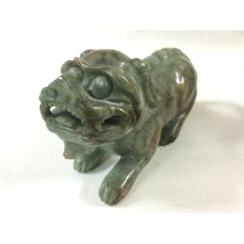 A carved jade Foo dog, 15cm long