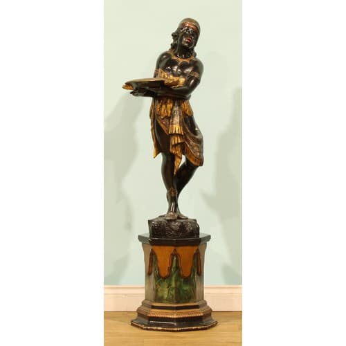 A Venetian parcel-gilt and polychrome decorated blackamoor f...