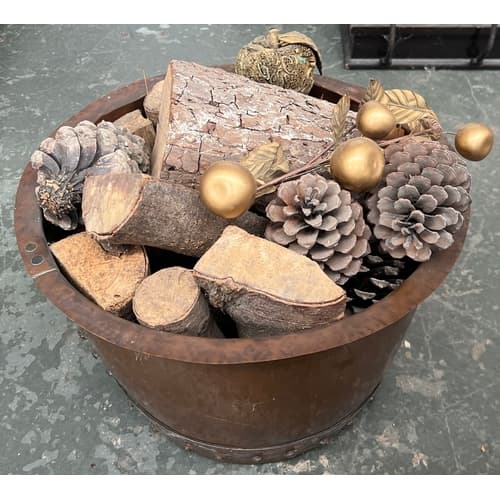 A small rivetted copper kettle/log basket