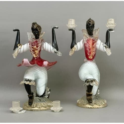 A pair of Italian Murano glass figural blackamoor candlestic...