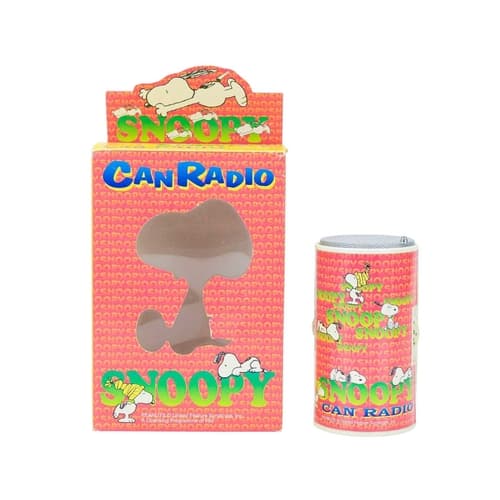 A Snoopy can radio, boxed. Produced by Alpan Products, model...