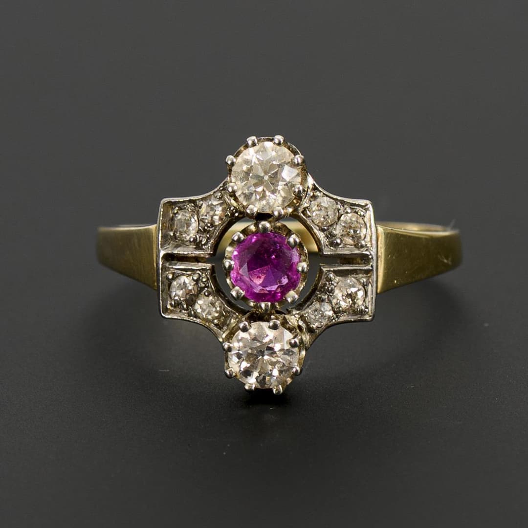 Art deco ring with red colored stone and old-cut diamonds.