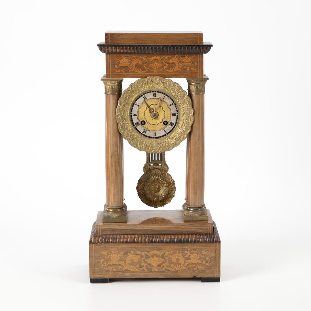 Late Biedermeier portal clock with floral inlays.