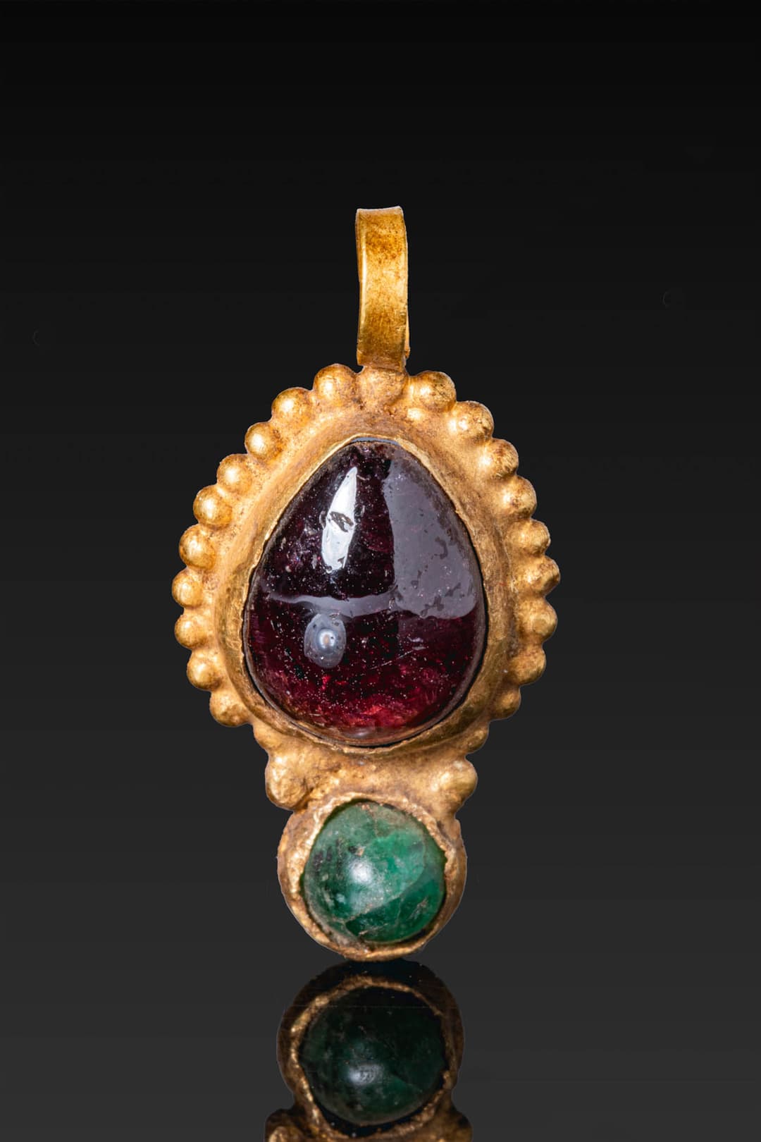 GREEK GOLD PENDANT WITH LARGE GARNET CABOCHON AND EMERALD