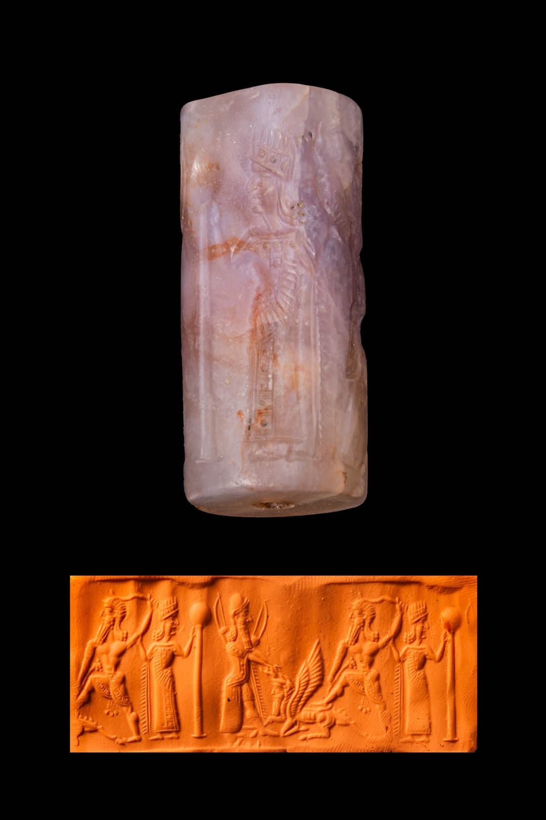 MESOPOTAMIAN AMETHYST CYLINDER SEAL WITH A SMITING HERO AND ATTENDANT FIGURES