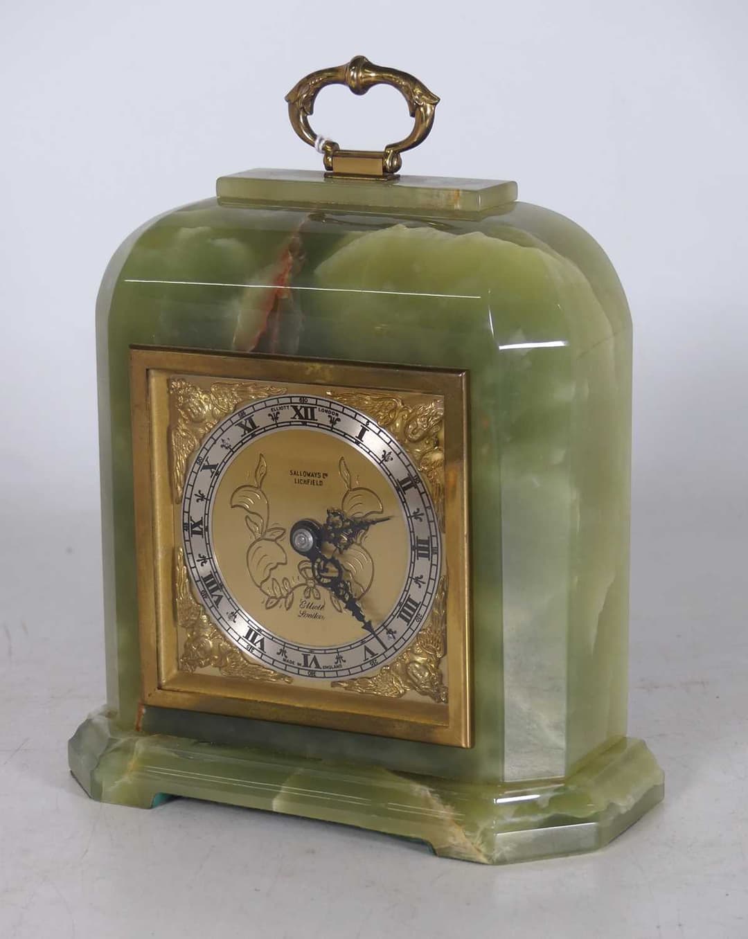 Lot 15 - Elliot of London, onyx and brass mantel clock