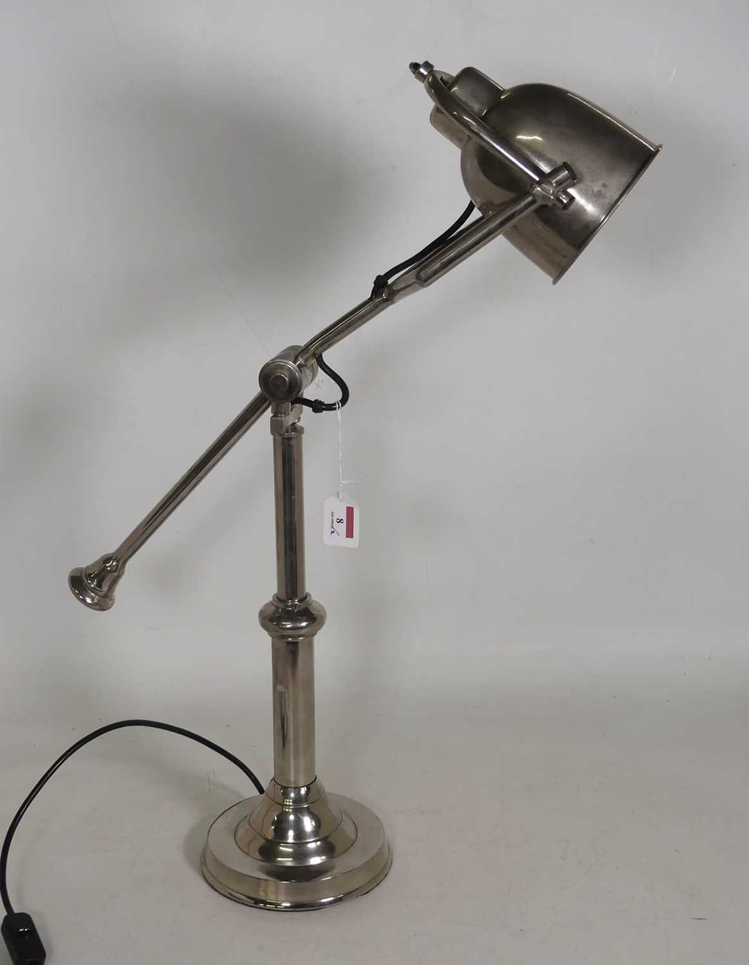 Lot 8 - A polished metal weighted desk lamp, h.70cm