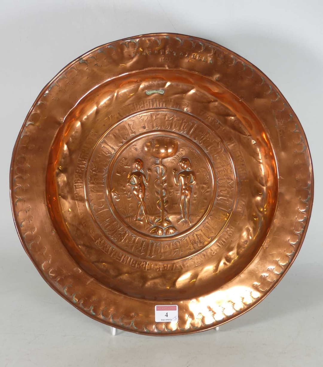 Lot 4 - A copper alms dish, central ground decorated