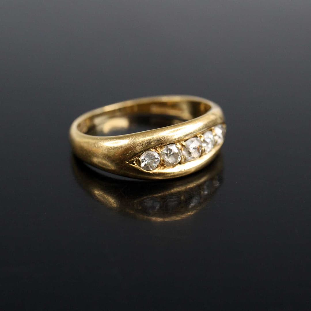 Lot 2006 - An Edwardian 18ct yellow gold diamond half