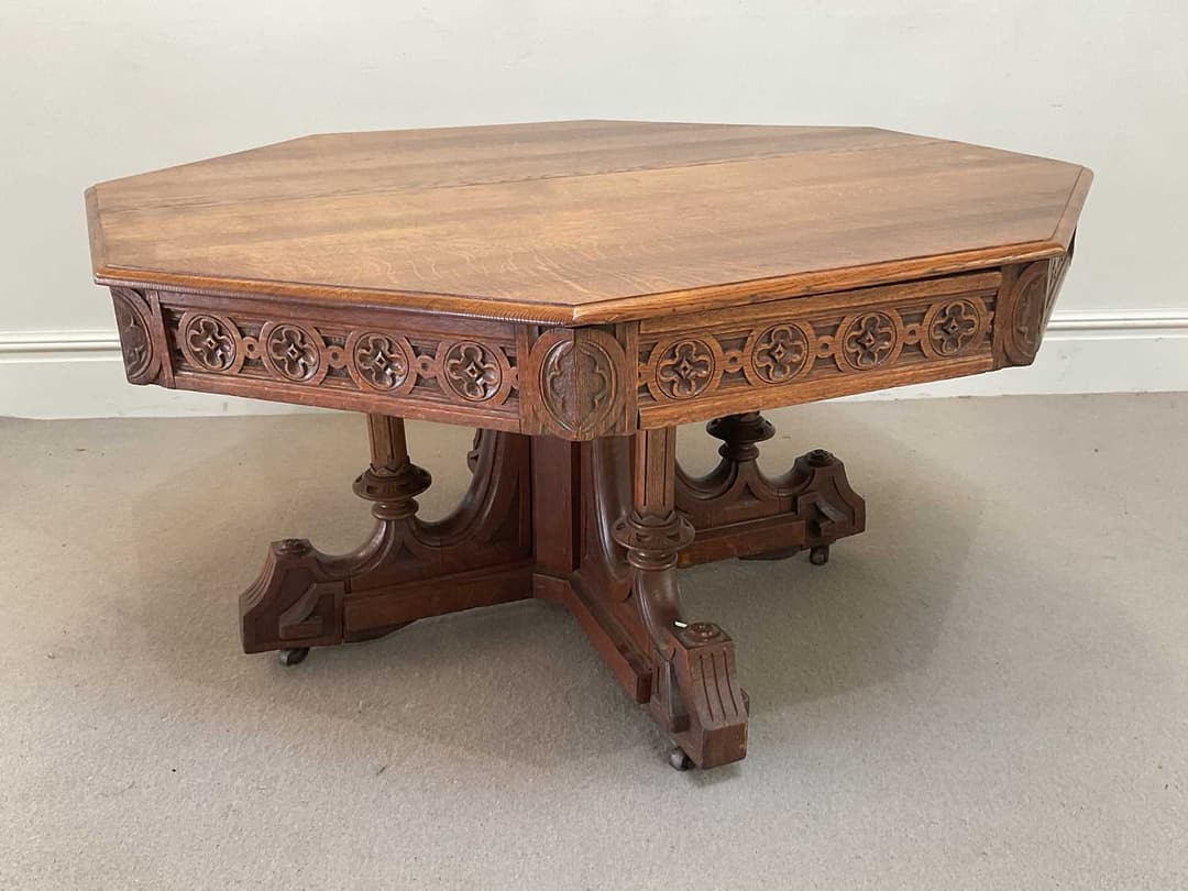 A Pugin style carved oak octagonal centre table