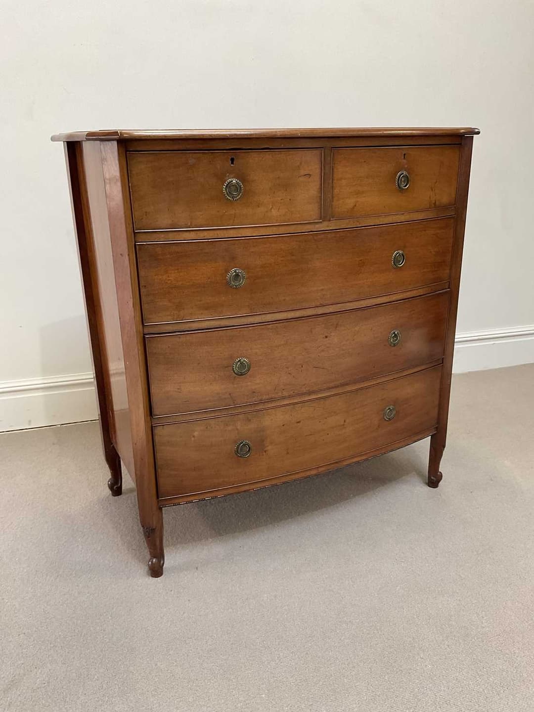 An early 20th century mahogany chest of two short over...