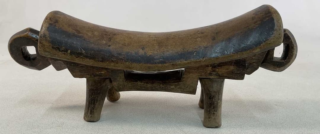 An African Sudanese carved wooden Dinka (Rex) headrest/shield