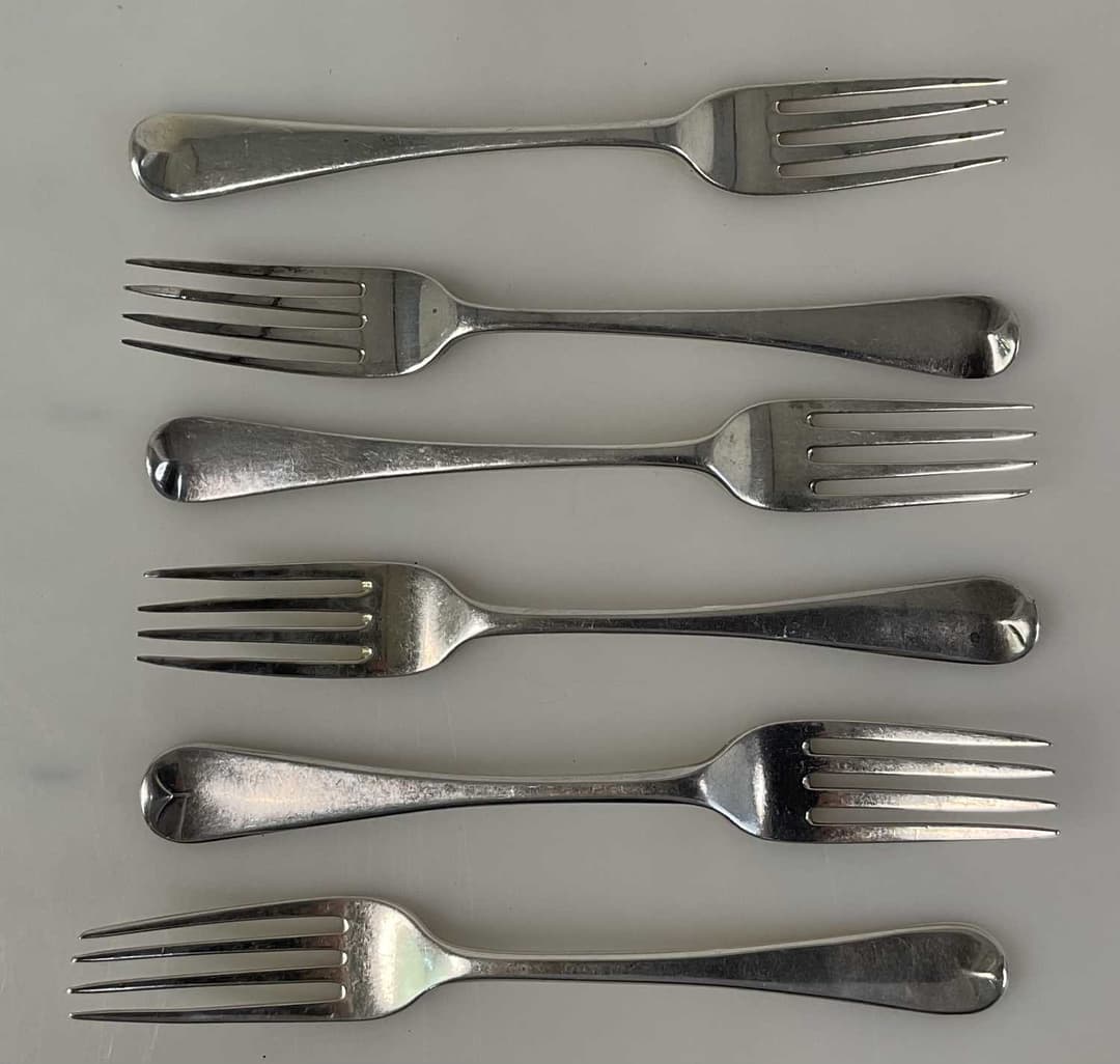 THOMAS WILKES BARKER; four George III hallmarked silver forks