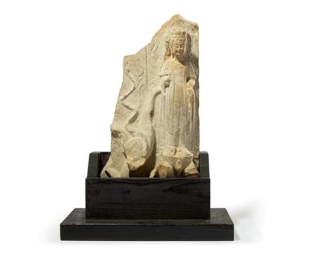 A Chinese limestone stele fragment with a standing...