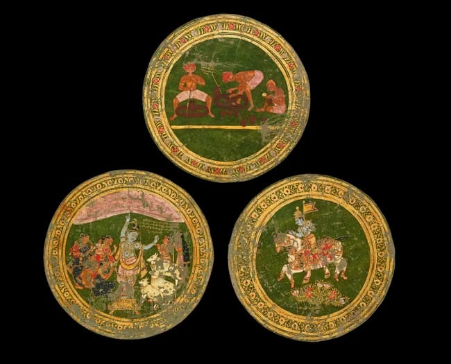 Three painted leather roundels depicting Krishna holding...