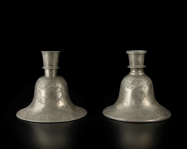 A pair of engraved tinned bell-shaped huqqa bases in the European taste