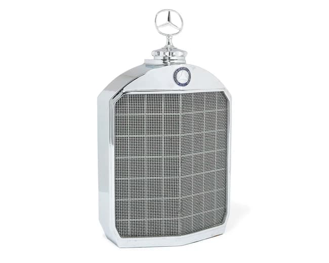 A Mercedes Benz chrome-plated decanter