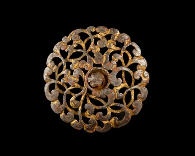 An openwork gilt steel shield bosse