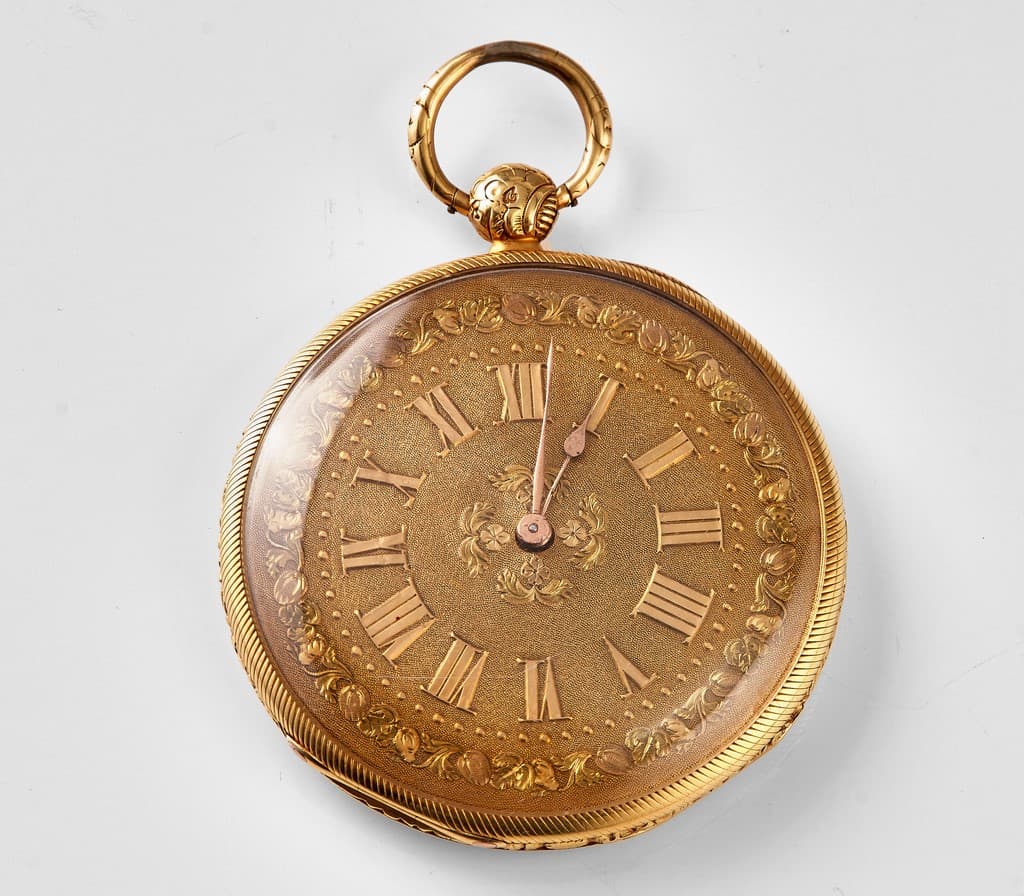 Montre à gousset extra-plate en or jaune à décor guilloché sur fond
