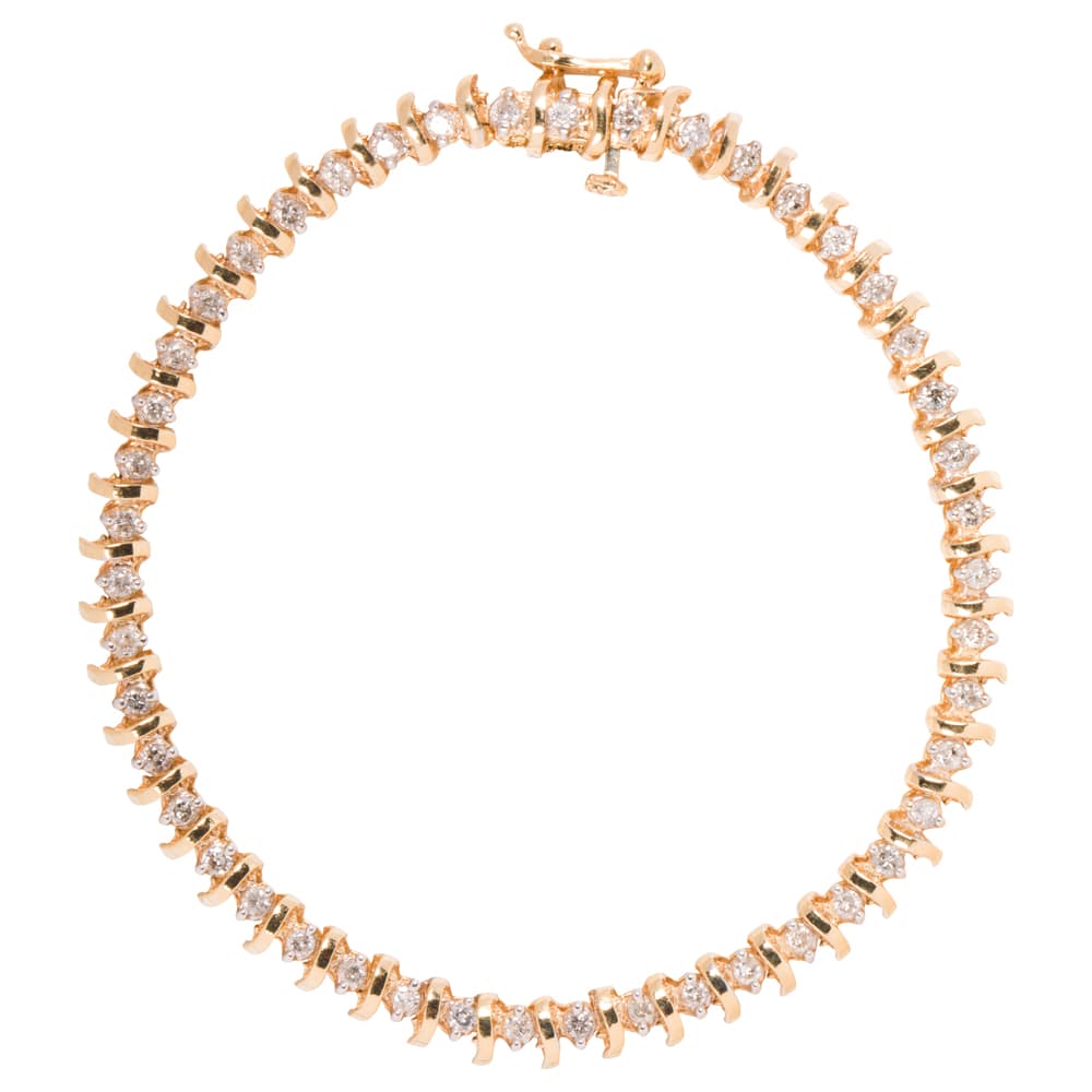 A diamond and 14k gold tennis bracelet